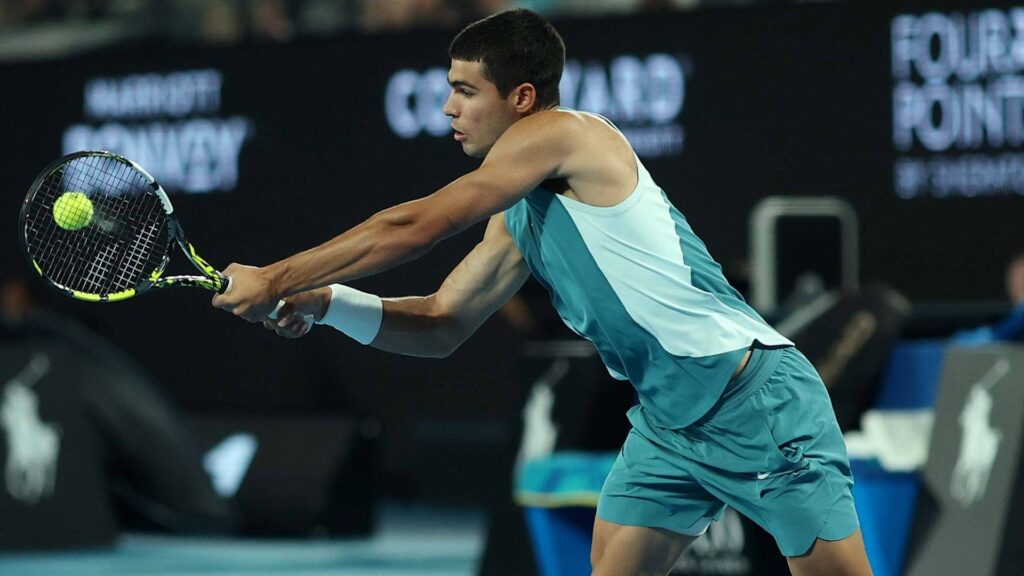 Carlos Alcaraz has gained an early edge in his highly anticipated Australian Open quarterfinal against Novak Djokovic, leading 6-4 after 54 minutes of intense play on Rod Laver Arena. The match unfolded in front of an electrified crowd on a windy Wednesday night. Both players exchanged early breaks in the opening three games, with Djokovic capitalizing on Alcaraz's slow start to go up 2-0. However, the Spaniard quickly found his rhythm, breaking back with a stunning 26-shot rally capped by a backhand winner down the line. The blustery conditions affected both competitors, with neither fully settling into their best form during the first set. Djokovic took a medical timeout at 4-5 to address an issue with his upper left leg, which was taped. Meanwhile, Alcaraz maintained his composure, using well-timed drop shots to outmaneuver Djokovic and secure the first set. According to Infosys Stats, Alcaraz struck 13 winners compared to Djokovic’s three, with the Serbian showing signs of limited movement and reduced aggression. At just 21 years old, Alcaraz is chasing history as the youngest player to complete a Career Grand Slam, having already claimed titles at the US Open (2022), Wimbledon (2023, 2024), and Roland Garros (2024). A win against Djokovic would also make him the second player in the Open Era to reach the semifinals at all four majors before turning 22, joining Djokovic, who achieved the feat at age 20 after winning the Australian Open in 2008. The head-to-head rivalry between the two currently favors Djokovic 4-3, with the Serbian winning their previous two hard-court encounters: a marathon battle in Cincinnati (2023) and another at the Nitto ATP Finals the same year. Alcaraz is still seeking his first victory over Djokovic on this surface. If Alcaraz advances, he will face second seed Alexander Zverev in the semifinals. Zverev secured his spot by defeating Tommy Paul in four sets earlier in the tournament. Djokovic, now 37, is vying for an unprecedented 11th Australian Open title and his 25th Grand Slam overall. His last failure to reach the Melbourne semifinals came in 2018, when he was defeated by Hyeon Chung in the fourth round. Despite early challenges in this year’s tournament, Djokovic has shown his class in recent matches, comfortably defeating Tomas Machac and Jiri Lehecka in straight sets. While Djokovic is aiming to reclaim dominance at the majors after a mixed 2024, Alcaraz is proving to be a formidable challenge, pushing for his seventh Grand Slam semifinal in pursuit of tennis history.